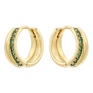 Detail view of gold hoop earrings with pavé set green zircons on a white background