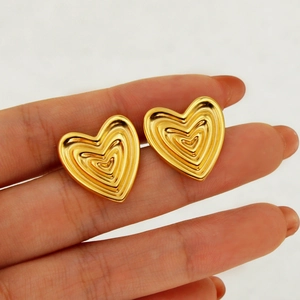 Exotic vintage gold heart stud earrings with textured multi-layered heart design