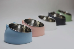 Detail showing five colors of slanted stainless steel pet bowls with cute cat ear design