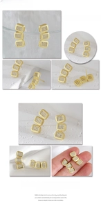 Detailed view of gold triple square earrings with zircon pave on white silk backdrop