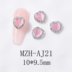 Detail of pink cat-eye heart nail charms with micro-rhestones and size 10x9.5mm