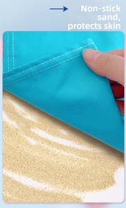 Detailed close-up of quick-dry sandproof fabric with durable white double stitching