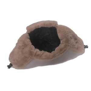 Detail of winter trapper hat showing thick plush faux fur and quilted thermal lining