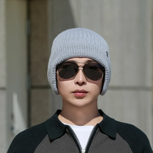 Winter knitted ear-flap beanie in light grey featuring a warm fleece lining and urban style