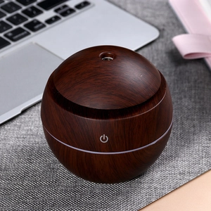 Spherical dark wood grain humidifier with USB mist spray and touch switch on desktop