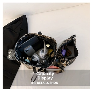 Interior view of leopard print tote bag showing large capacity for gadgets and cosmetics