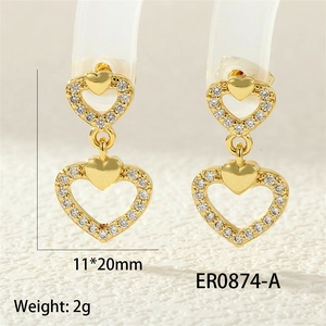 Detailed size view of gold heart earrings with white zircons measuring 11x20mm