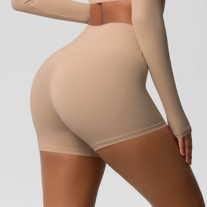 Detailed close-up showing high waist tummy control and peach lift effect of yoga shorts