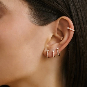Detail of S925 sterling silver gold earrings set with sparkling marquise zirconia