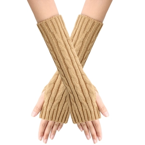 Close-up of khaki cable-knit arm warmers showing thick braided texture and fingerless design