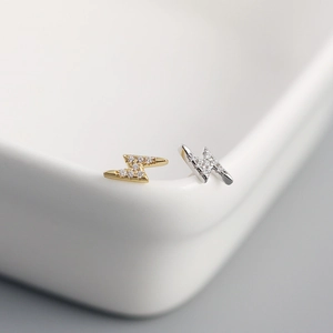 Detail view of s925 sterling silver lightning bolt studs with sparkling zircon stones