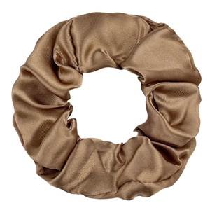 Detailed view of bronze brown satin scrunchie featuring smooth silk-like texture and folds