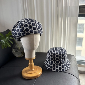 Navy blue beret and bucket hat set featuring white lace mesh and embroidery patterns