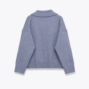 Flat lay of a lavender cashmere blend polo knit sweater showing back view and drop shoulders