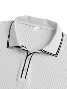 Detail of white striped polo shirt collar with buttons and ribbed fabric texture
