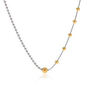 Close-up of two-tone 18K gold and silver beaded Y-chain necklace on a white background