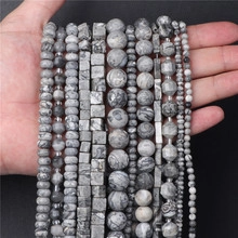 Close-up of various natural blue spot jasper beads in square and round shapes for DIY jewelry