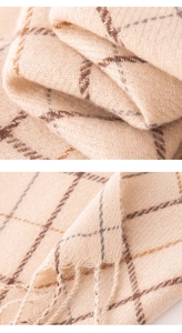 Close-up of beige and brown checkered wool blend scarf showing soft fringe details