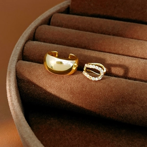 Detailed view of 18k gold plated ear cuffs featuring smooth and zircon micro-pave designs