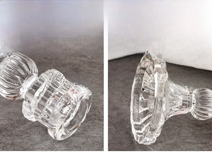 Macro view of Nordic glass candle holder featuring ribbed texture and transparent finish