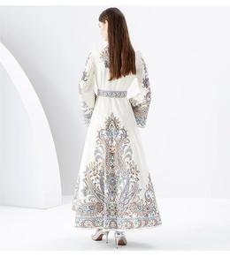 Detail shot of boho long dress showing intricate paisley print and elegant A-line silhouette