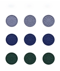 Detail of hollow lotus and daisy heat-resistant silicone table mats in multiple colors