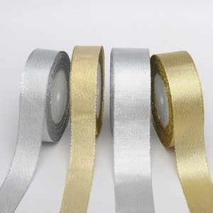 Glittering gold and silver metallic ribbons for Christmas DIY gifts and decorations