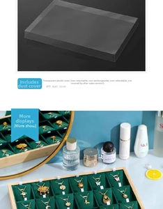 Close-up of dark green velvet jewelry tray with necklace hooks and transparent dust cover