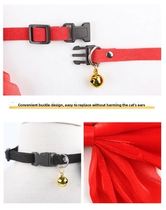 Detail of adjustable pet pearl necklace with velvet bow, safety buckle and gold bell