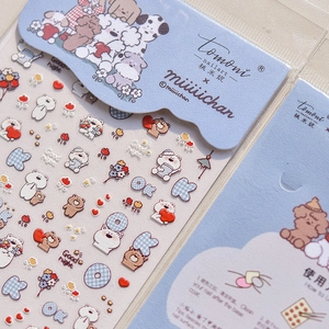 Detail of embossed dog and bear nail stickers with miiiichan illustration branding