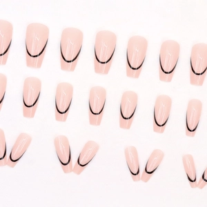 French press-on nails with nude pink base and black U-shaped lines in coffin shape