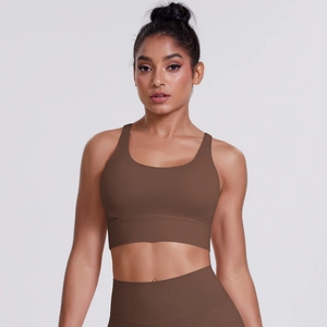 Detail of high-waist yoga leggings and sports bra in dark coffee brushed fabric