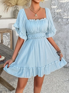 Detail of light blue mini dress with square neckline and ruffled sleeves for summer vacation