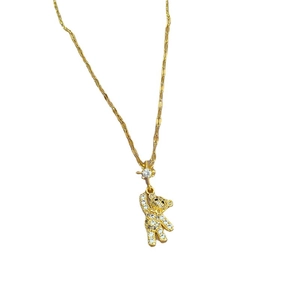 Titanium gold bear pendant necklace with sparkling crystals on a clean white background