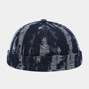 Detailed close-up of dark blue denim miki hat with white jacquard vintage texture