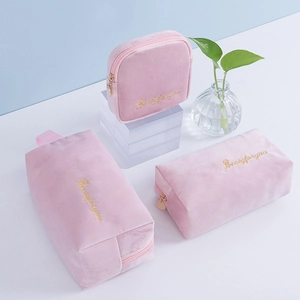 Pink flannel cosmetic bag set with golden embroidery and zipper in various sizes