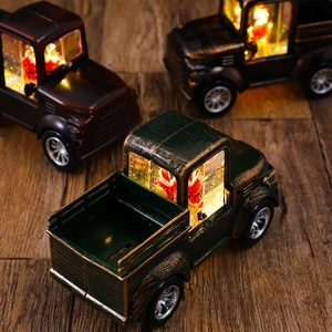 Detail of vintage Christmas truck lanterns with Santa Claus and sparkling water glitter effect