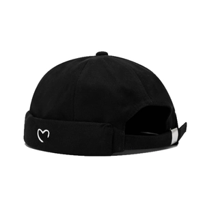 Minimalist black docker hat with small heart embroidery and adjustable metal buckle strap