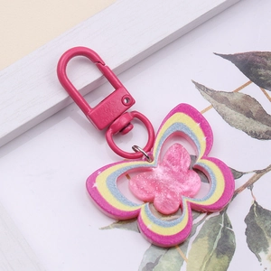 Pink butterfly acrylic keychain with glitter finish and matching metal lobster clasp