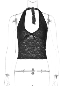 Close-up of black lace halter top showing V-neckline and delicate ribbon bow detail