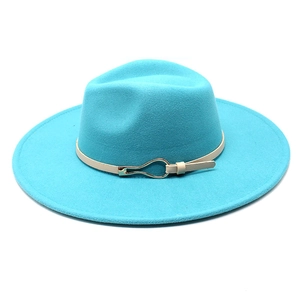 Macro detail of sky blue wool felt hat featuring a cream leather band and gold metal buckle