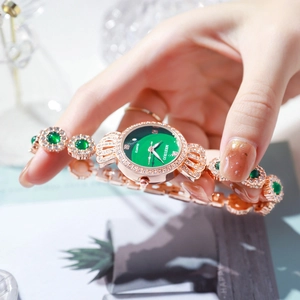 Elegant gold quartz watch with a textured green dial and sparkling gemstones for women