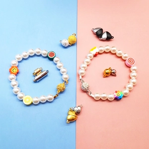 Colorful pearl bracelet with cartoon charms and strong magnetic heart clasp closure