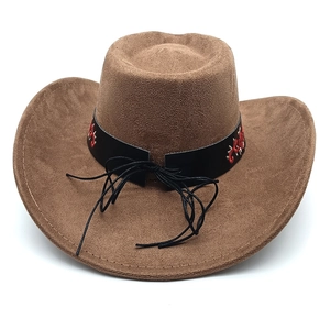 Detail of western cowboy hat with brown faux suede fabric and ethnic embroidery band