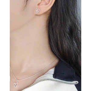 Elegant silver S925 heart pretzel necklace and stud earrings set on female model