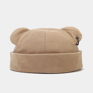 Detail of khaki beanie with cute bear ears and black metal ring streetwear accessory