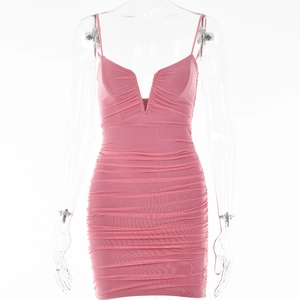 Detail of pink V-neck bodycon mini dress featuring elegant ruching and sleeveless design