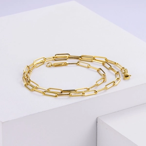 Detailed view of 4mm 18k gold plated stainless steel paperclip chain with lobster clasp