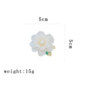 Detailed view of white camellia pearl brooch with dimensions 5cm and 15g weight