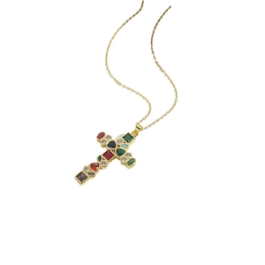 Golden necklace with a cross pendant featuring vibrant colorful gemstones on white background